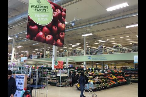 Large Rosedene Farms signage hangs proudly above the fruit and vegetables aisles
